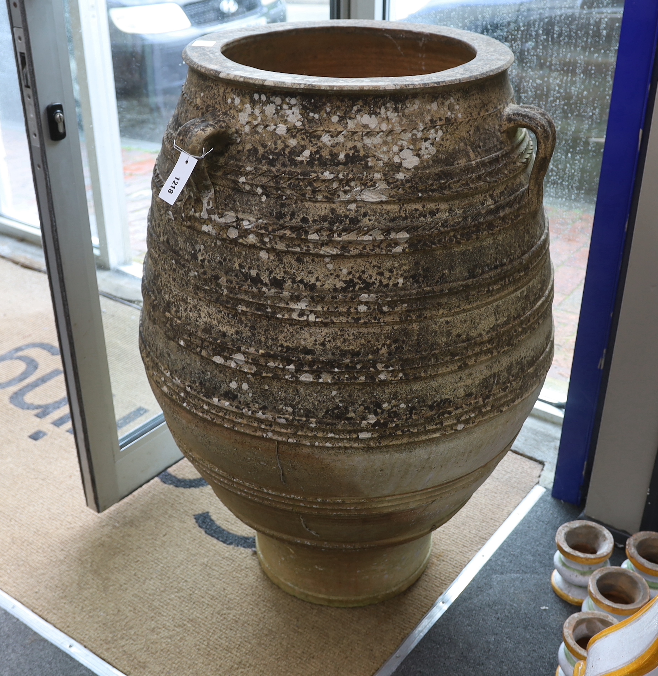 A Greek earthenware oil jar, height 103cm